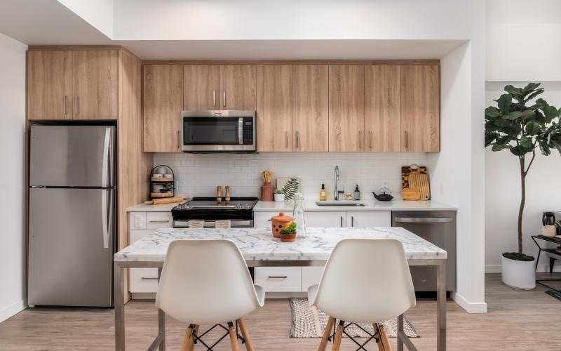 a kitchen with a table and chairs